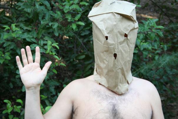 There's nothing creepier than a friendly half-naked guy with a paper bag over his head in the woods.